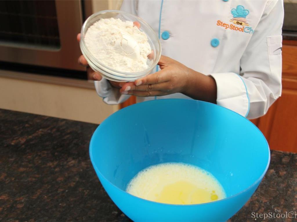 Step 1 of Turkey Sausage Popovers Recipe: Preheat oven to 400 degrees F (200 degrees C) and spray muffin pan with cooking spray. Mix Olive Oil (1 tablespoon), Salt (1/4 teaspoon), All-Purpose Flour (1 cup), Milk (1 cup), and Egg (2) until smooth.