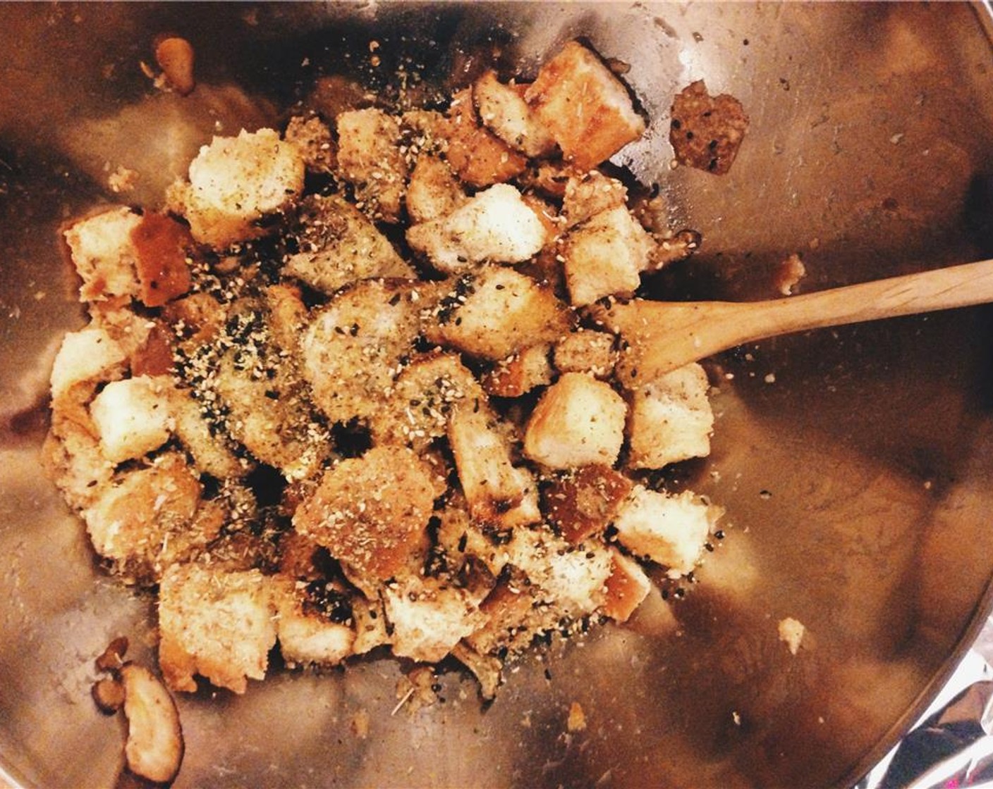 step 7 When the bread cubes are toasted, combine them with the chorizo, mushrooms, Furikake (1 tsp), Shallot (1), Garlic (1 clove), Crushed Red Pepper Flakes (to taste), and the remaining mixed herbs in a large bowl. Turn the oven down to 180 degrees C (350 degrees F).