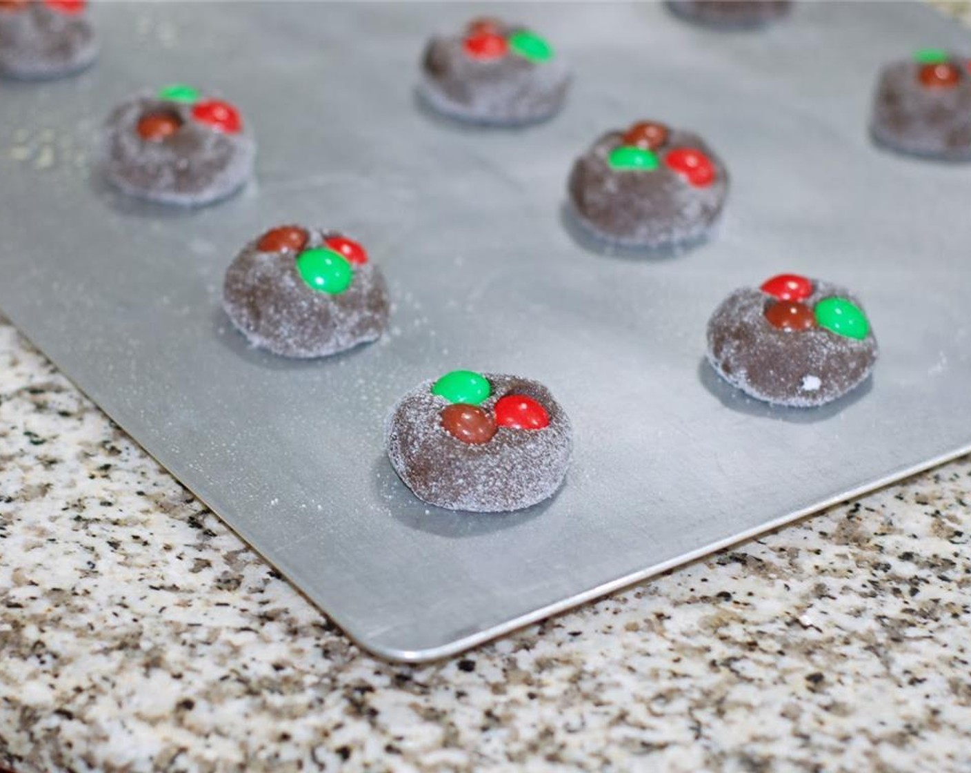 step 6 Bake 10 minutes at 375 degrees F (190 degrees C). Remove from the oven and place on cooling racks until completely cooled. You can eat the remaining M&Ms while you wait!