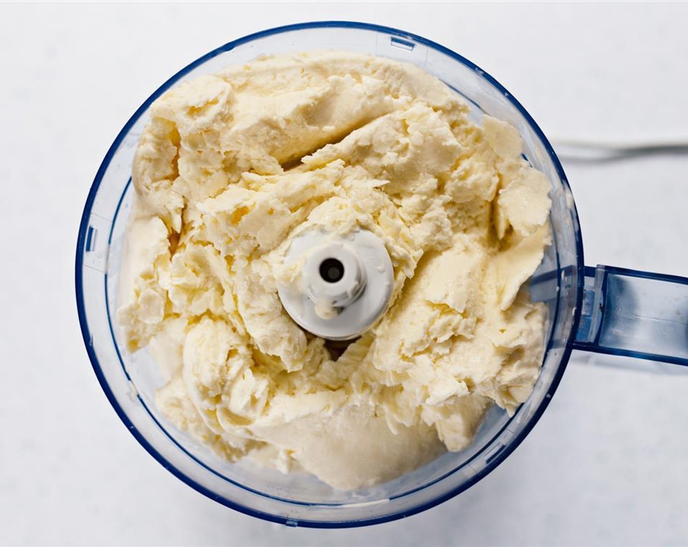 step 6 Remove ice cream pieces from bag, and place in a food processor.