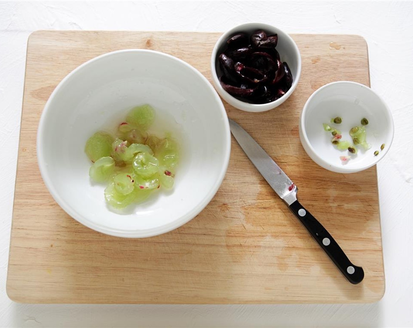 step 3 To peel and seed the Muscadines (3/4 cup), cut them in half, starting at the stem end. Work over a bowl to catch excess juice, remove the seeds and discard, then press the flesh from the skin. Put the flesh in with the juice, and reserve the skins.