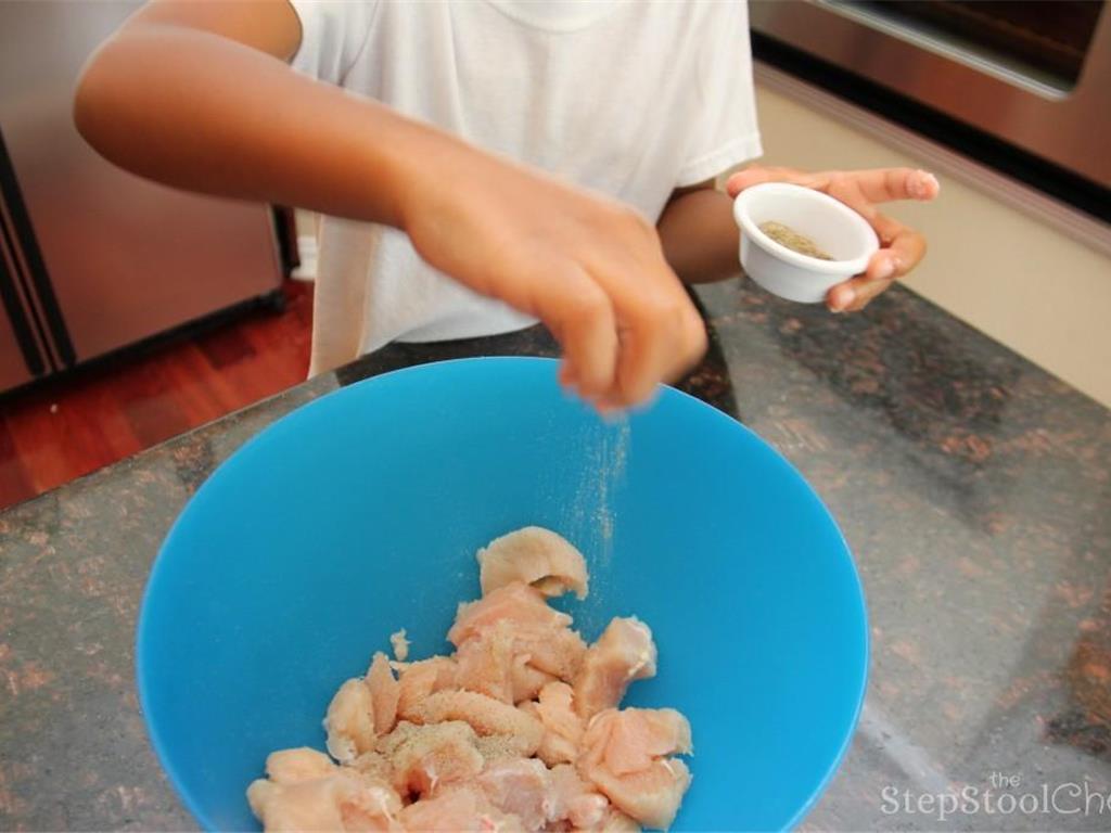 Step 4 of Chicken Broccoli and Rice Casserole Recipe: Transfer the cubed chicken to a large mixing bowl. Season with Salt (to taste) and Ground Black Pepper (to taste).