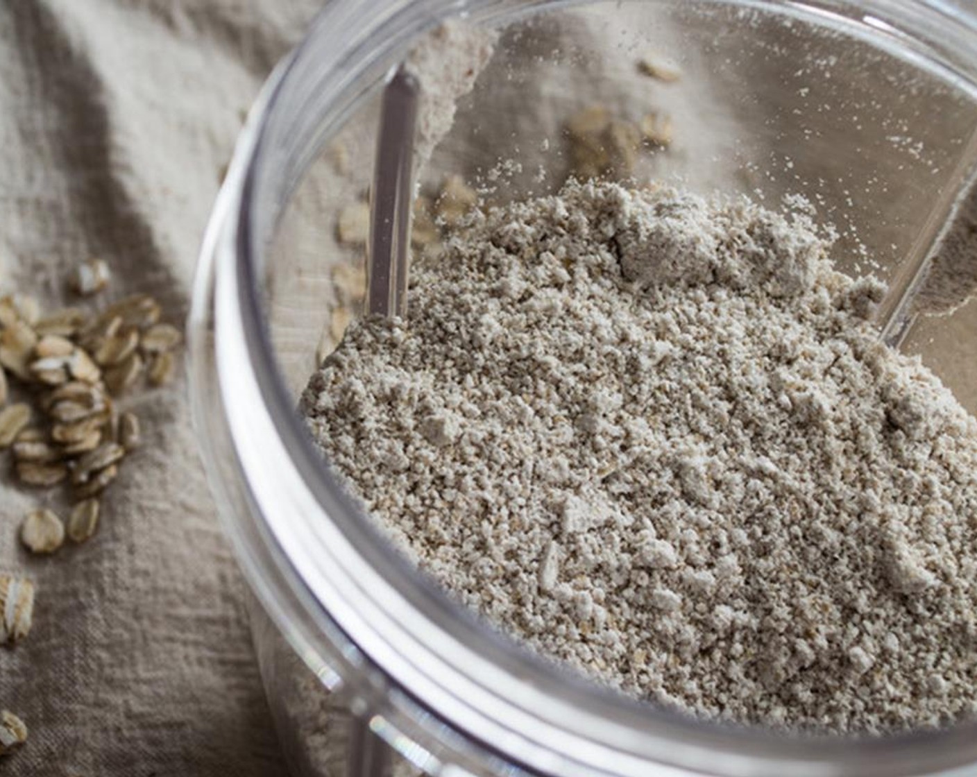 step 3 Add Oats (1 1/4 cups) to NutriBullet or food processor and blend 8-10 seconds to create a find flour-like consistency. Repeat with the Cashew Meal (1/4 cup) but only for 5-6 seconds.