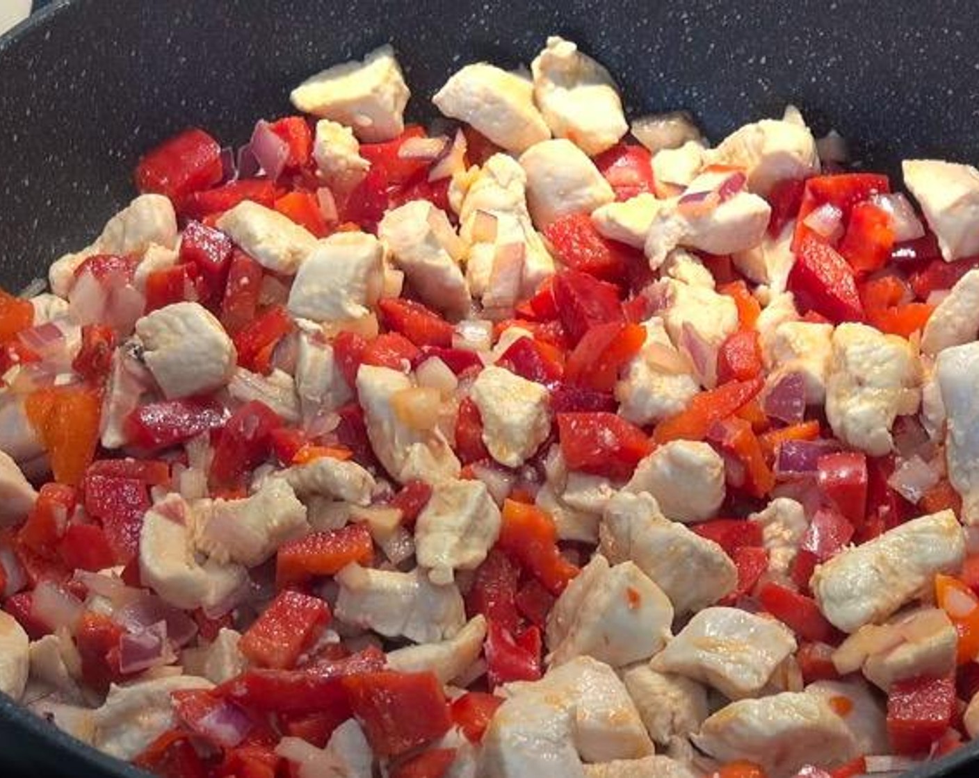 step 2 Add Red Onion (1) and Red Bell Peppers (2). Cook, stirring occasionally, until vegetables have started to soften.