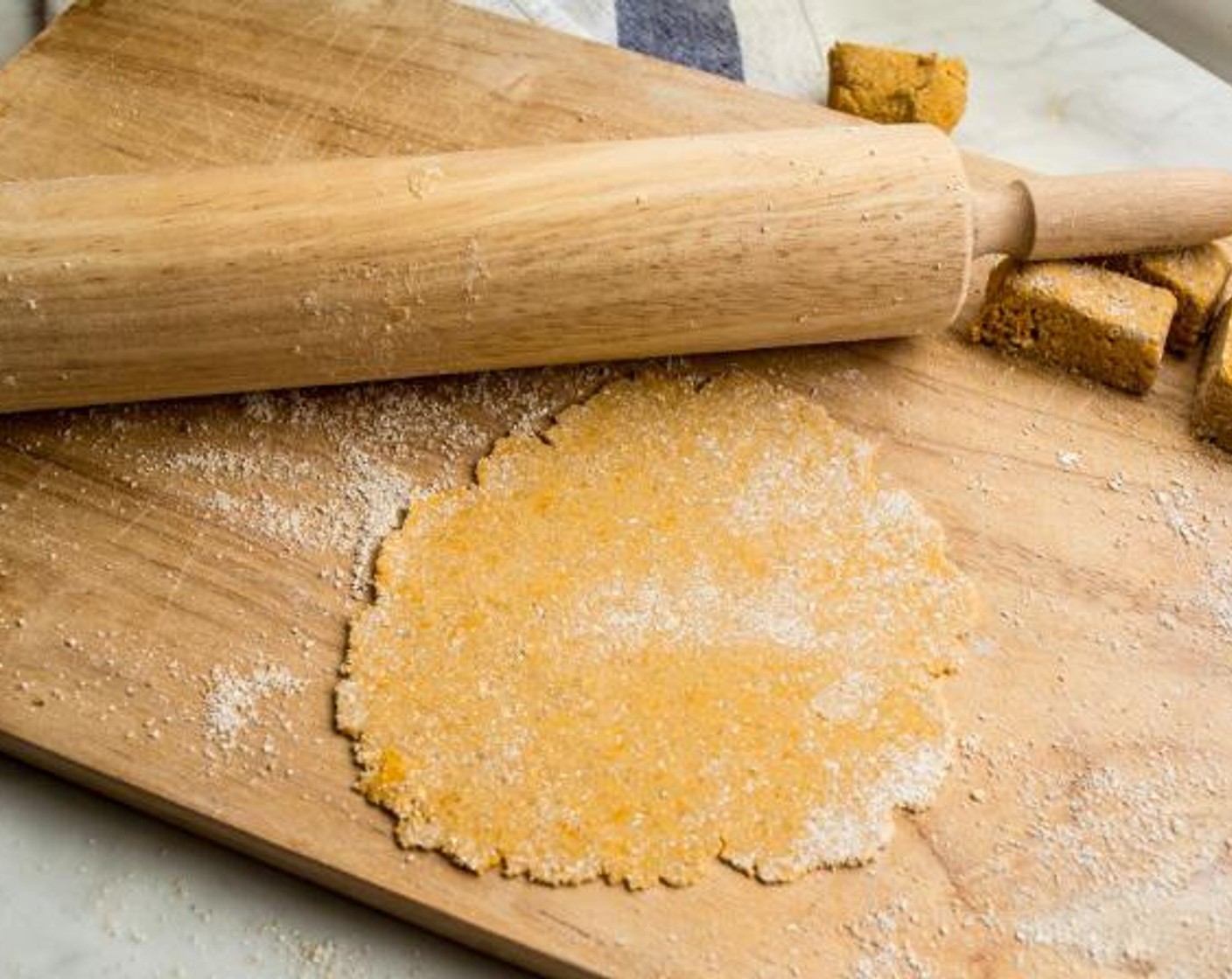 step 4 Make sure work surface is still coated with oat flour, then roll each piece into a round ball and use a rolling-pin to roll into a thin round tortilla shape - approximately 6-8" in diameter.