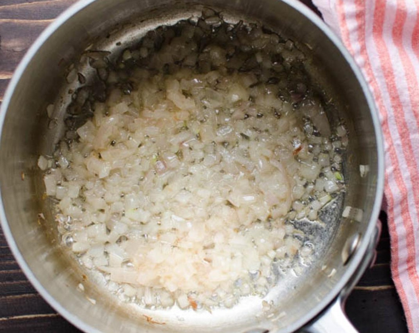 step 6 In a small saucepan over medium high heat, melt the Butter (1 Tbsp) and add the minced Shallots (2). Saute the shallots until tender and translucent.