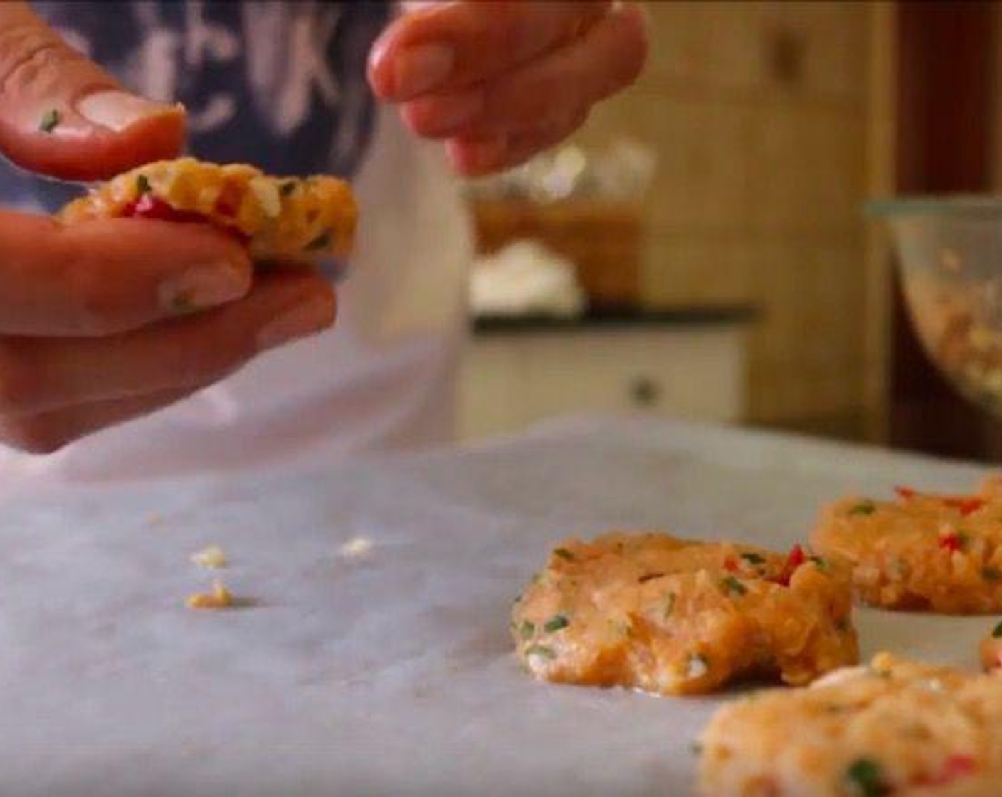 step 12 Using your hands, start forming the mixture into balls the size of a golf ball and then gently push down on them to form a patty that is about 1/2-inch thick and place on parchment paper. You should end up with about 10 tuna patties.