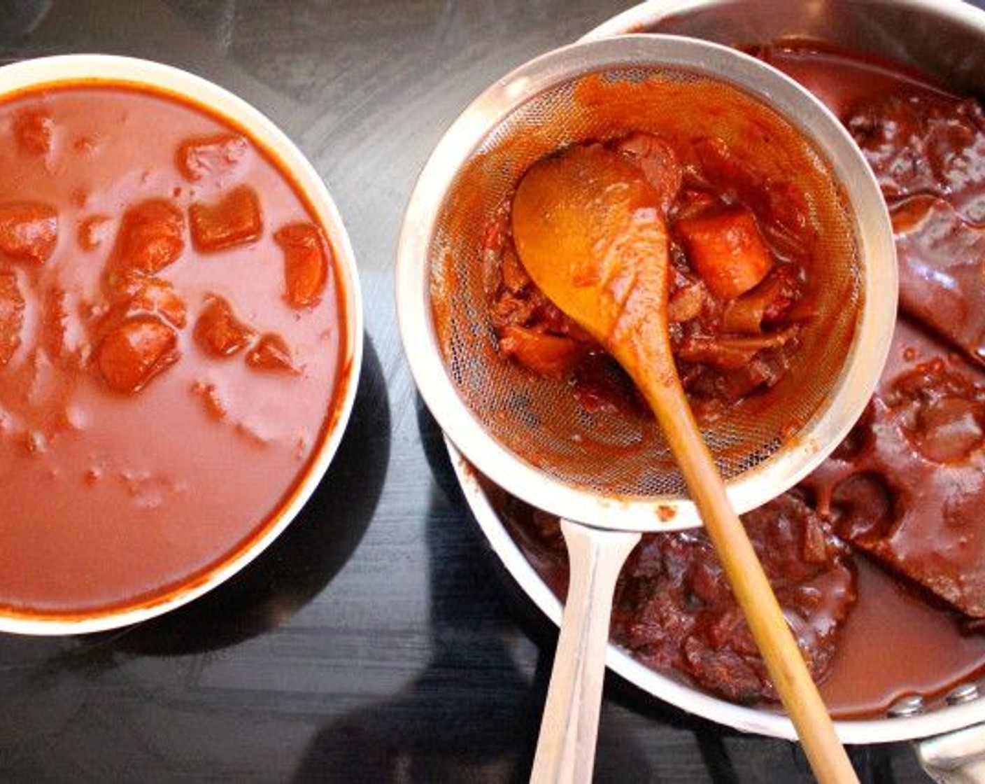 step 4 Transfer the meat to another pot, strain enough of the sauce for one portion, then save the rest of the sauce with the vegetables for another dish.