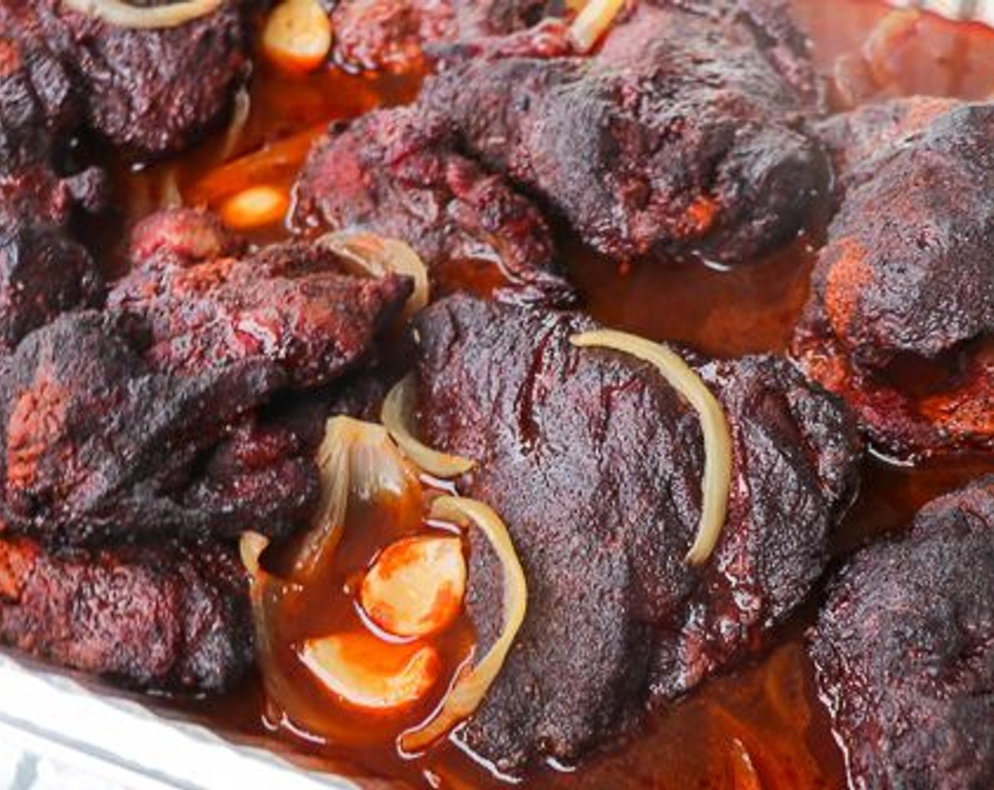 step 5 Insert wired probe thermometer into one of beef cheeks; cover pan with aluminum foil; return to pit until internal temperature reaches 210 degrees F (98 degrees C).