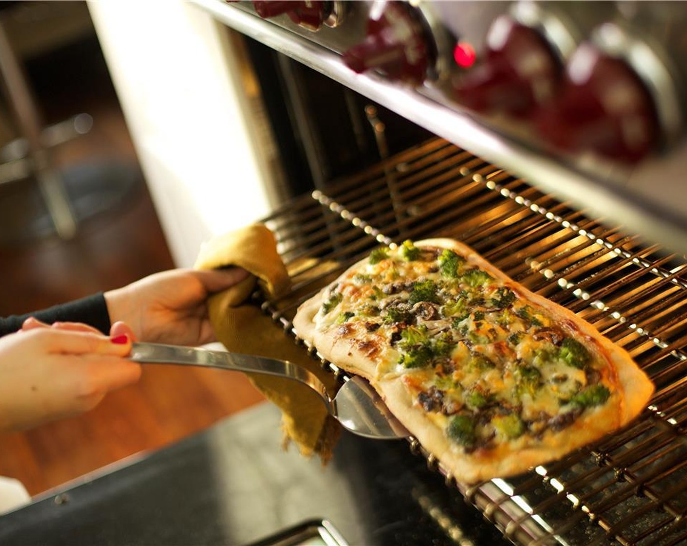 step 14 Using a spatula, remove the pizza from the sheet pan and place the pizza directly onto the middle oven rack for an additional 5 minutes.