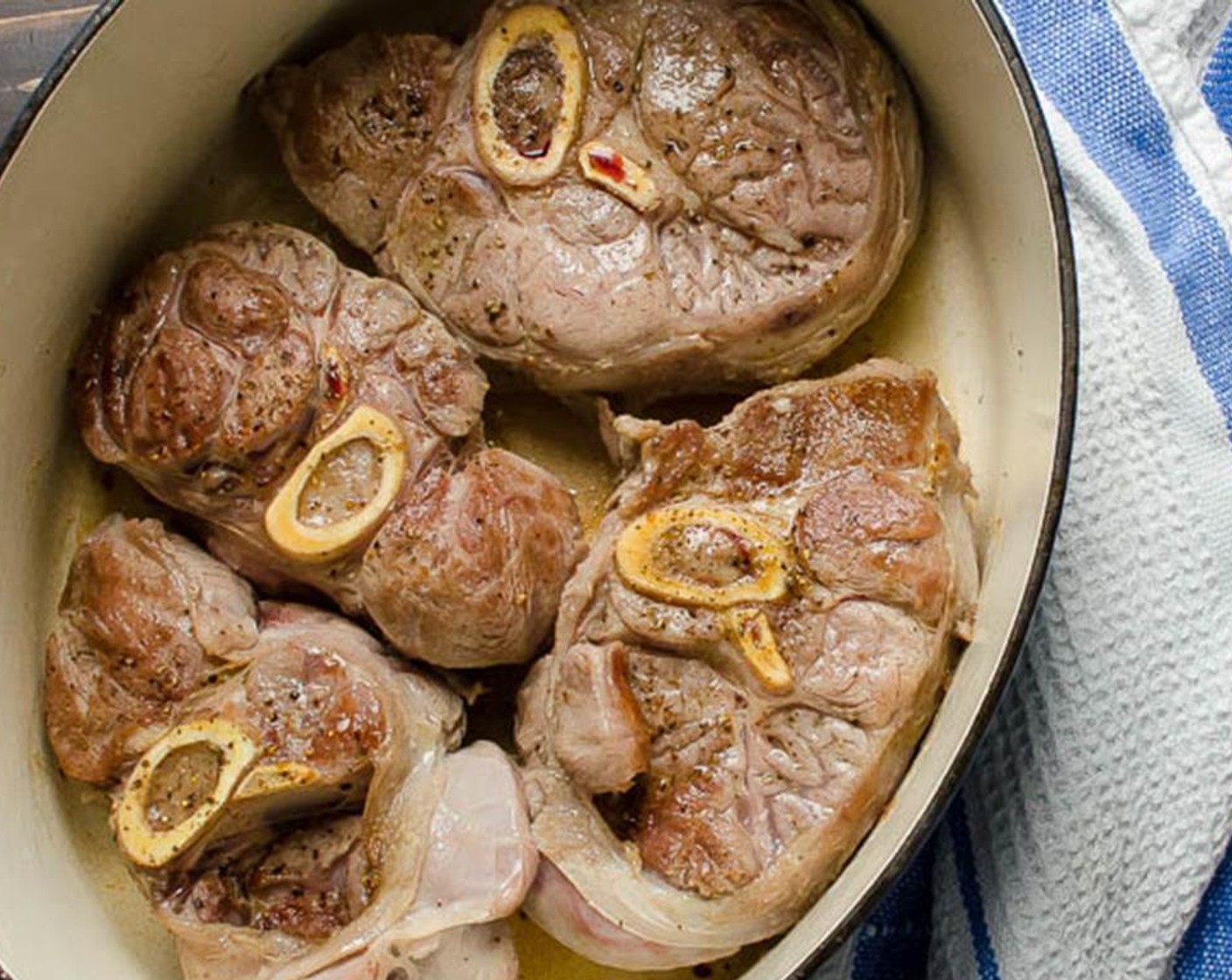 step 6 Carefully add the veal and brown for 3-4 minutes on each side, turning with a pair of kitchen tongs. Transfer the veal to a large plate or platter.