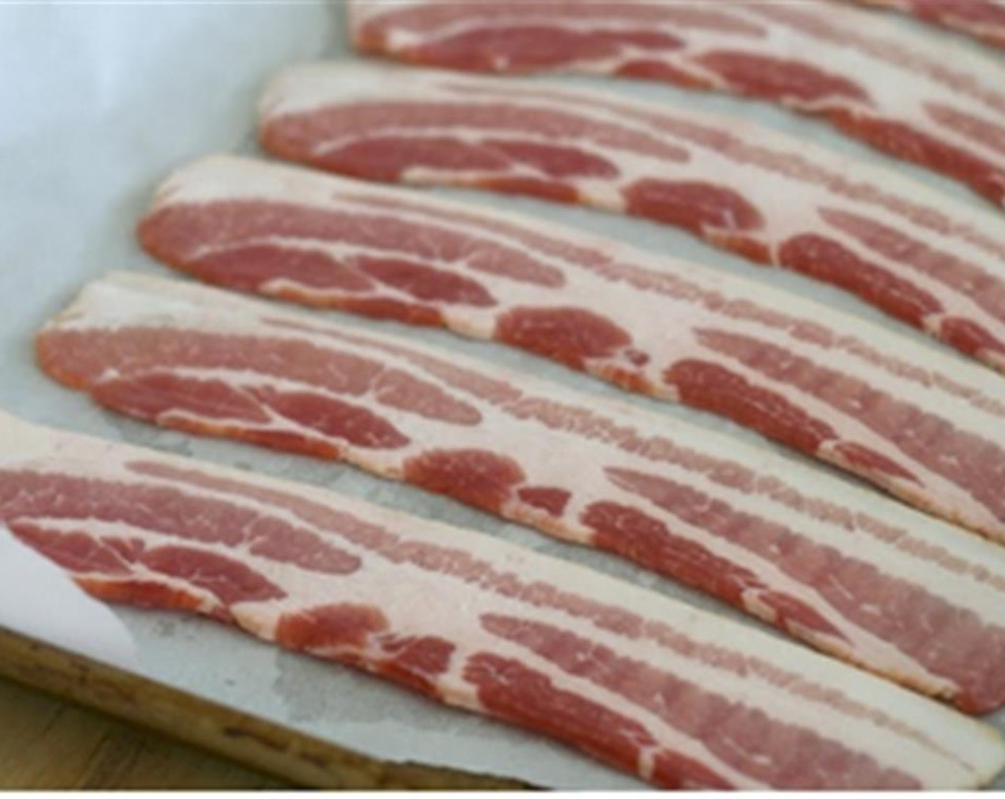 step 5 Lay out the Center Cut Bacon (8 oz) on the non stick baking tray cover with the other pan so that the bacon is sandwiched between the two pans.