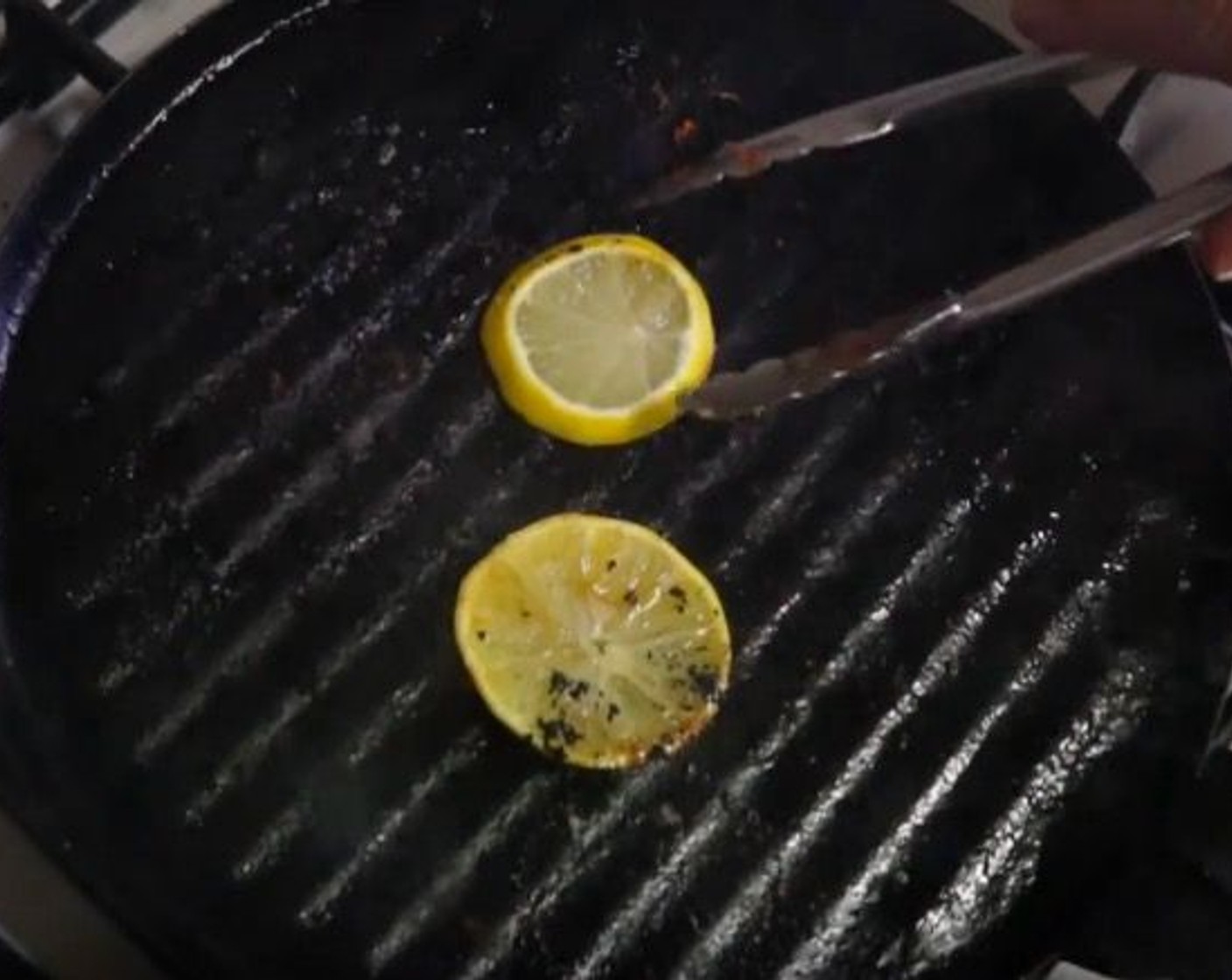 step 8 Add Lemon (1) Slices to the pan and grill for a couple of minutes.