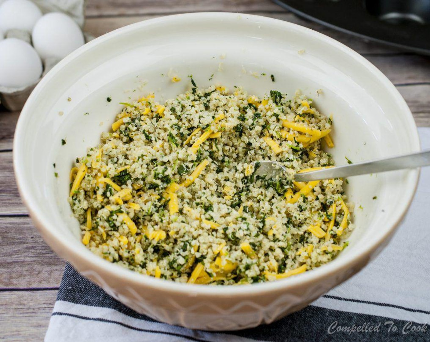 step 3 In a medium-sized bowl, stir together cooked Quinoa, Frozen Spinach (1 cup), Shredded Cheddar Cheese (3/4 cup), Grated Parmesan Cheese (1/2 cup), Dijon Mustard (1 tsp), Dried Oregano (1 tsp), McCormick® Garlic Powder (1/4 tsp), Kosher Salt (1/2 tsp), and Ground Black Pepper (1/4 tsp).