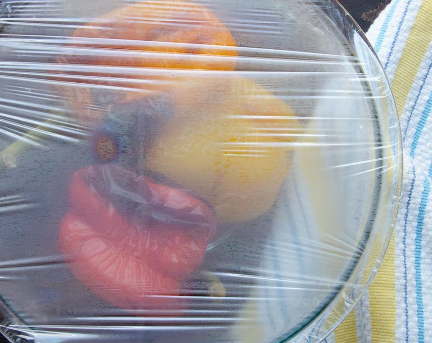 step 3 Remove and transfer peppers to a bowl. Cover with plastic wrap and let the peppers steam in the bowl.