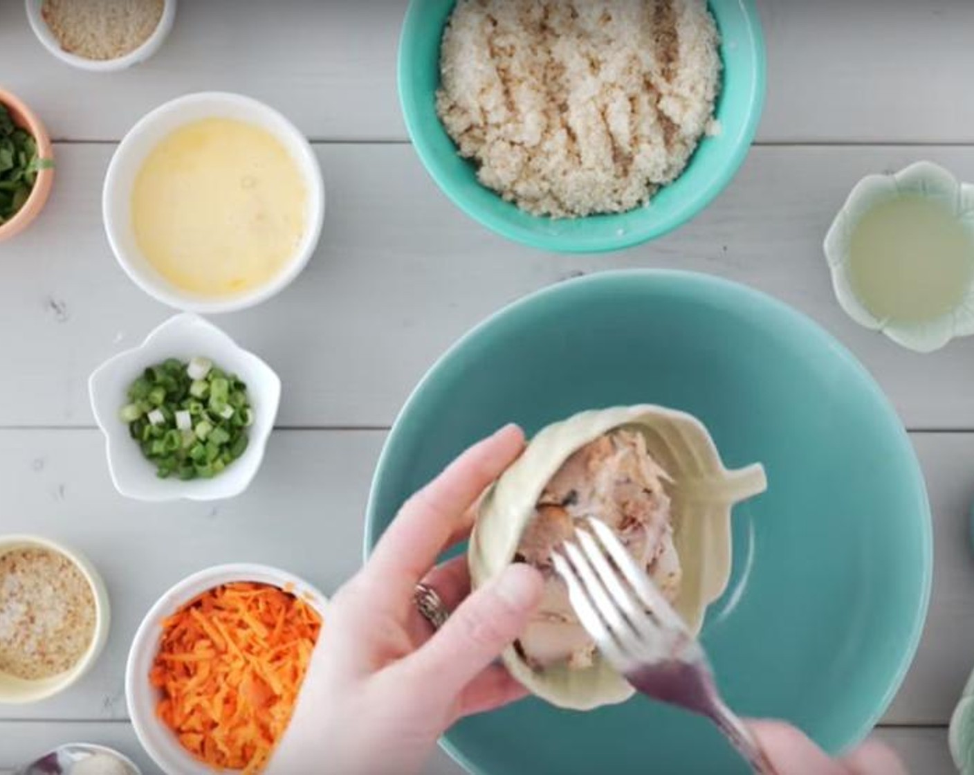 step 1 Mix together White Quinoa (1/2 cup), Water (1 cup), Wild Salmon (6 oz), Carrot (1), Scallion (1 bunch), Eggland's Best Classic Eggs (2), Fresh Herbs (4 Tbsp), Dijon Mustard (2 Tbsp), Ground Flaxseed (2 Tbsp), Simply Organic Garlic Powder (1/2 tsp), Sea Salt (1 pinch) and Ground Black Pepper (1 pinch) in a bowl.