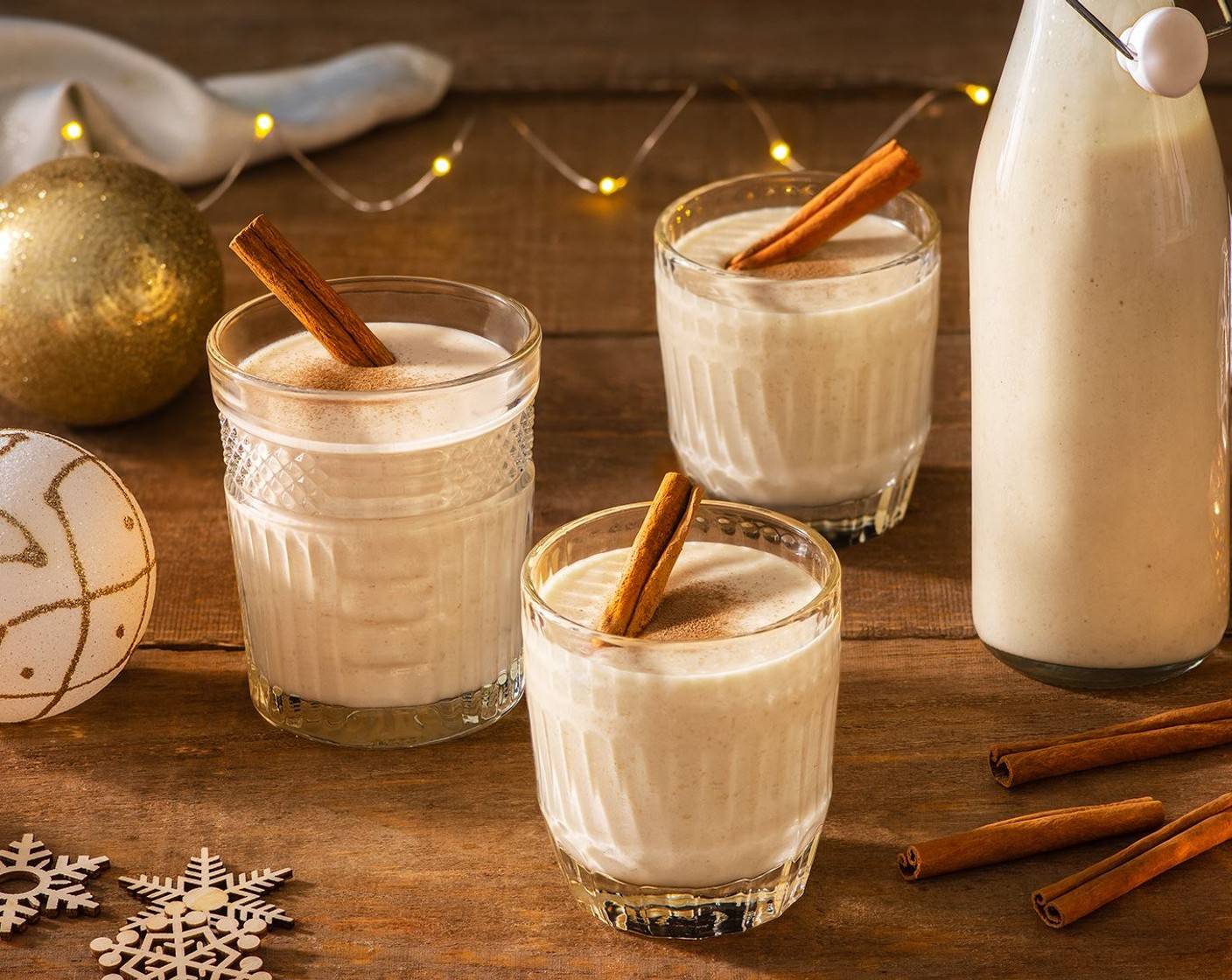 step 3 To serve, stir or shake bottle well to combine. Pour coquito into small serving glasses. Garnish with ground cinnamon and Cinnamon Sticks (to taste), if desired.