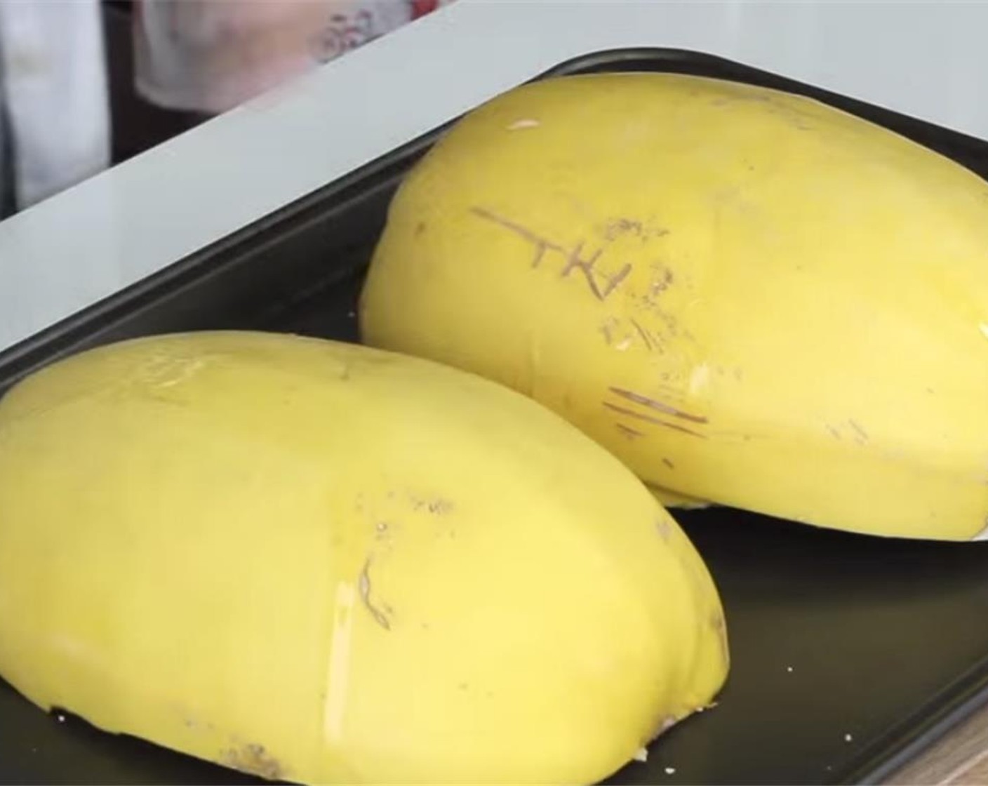 step 4 Turn the squash over onto baking pans so they're cut side down.