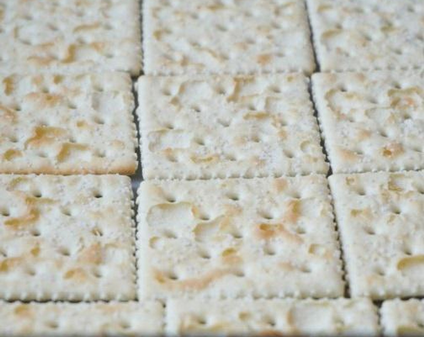 step 2 Lay parchment paper in a 9x13-inch baking dish. Add the Saltine Crackers (30) in one layer to the bottom of the dish for the crust.
