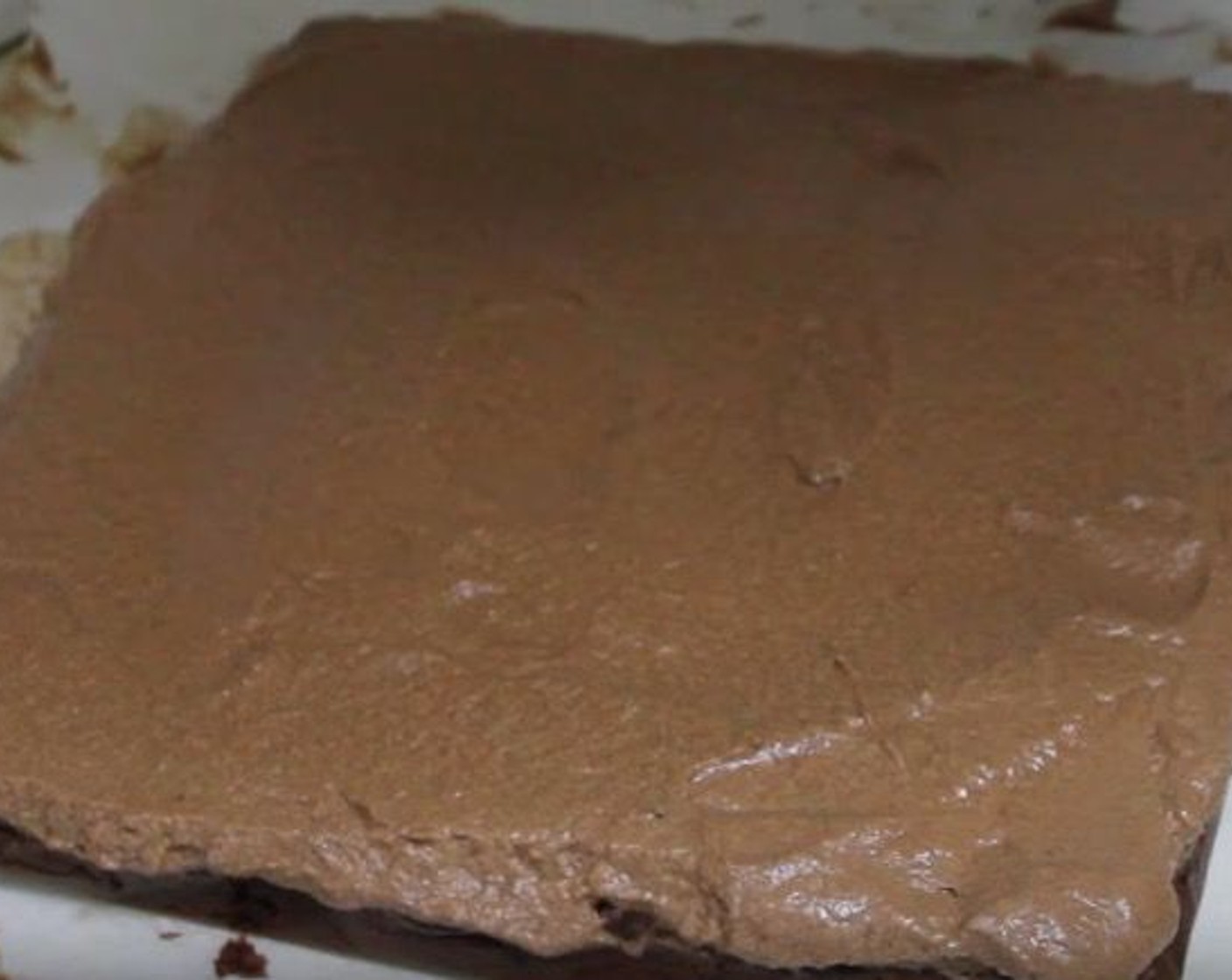 step 9 Spread chocolate mousse over cooled brownies. Place in fridge to cool for 30 minutes.