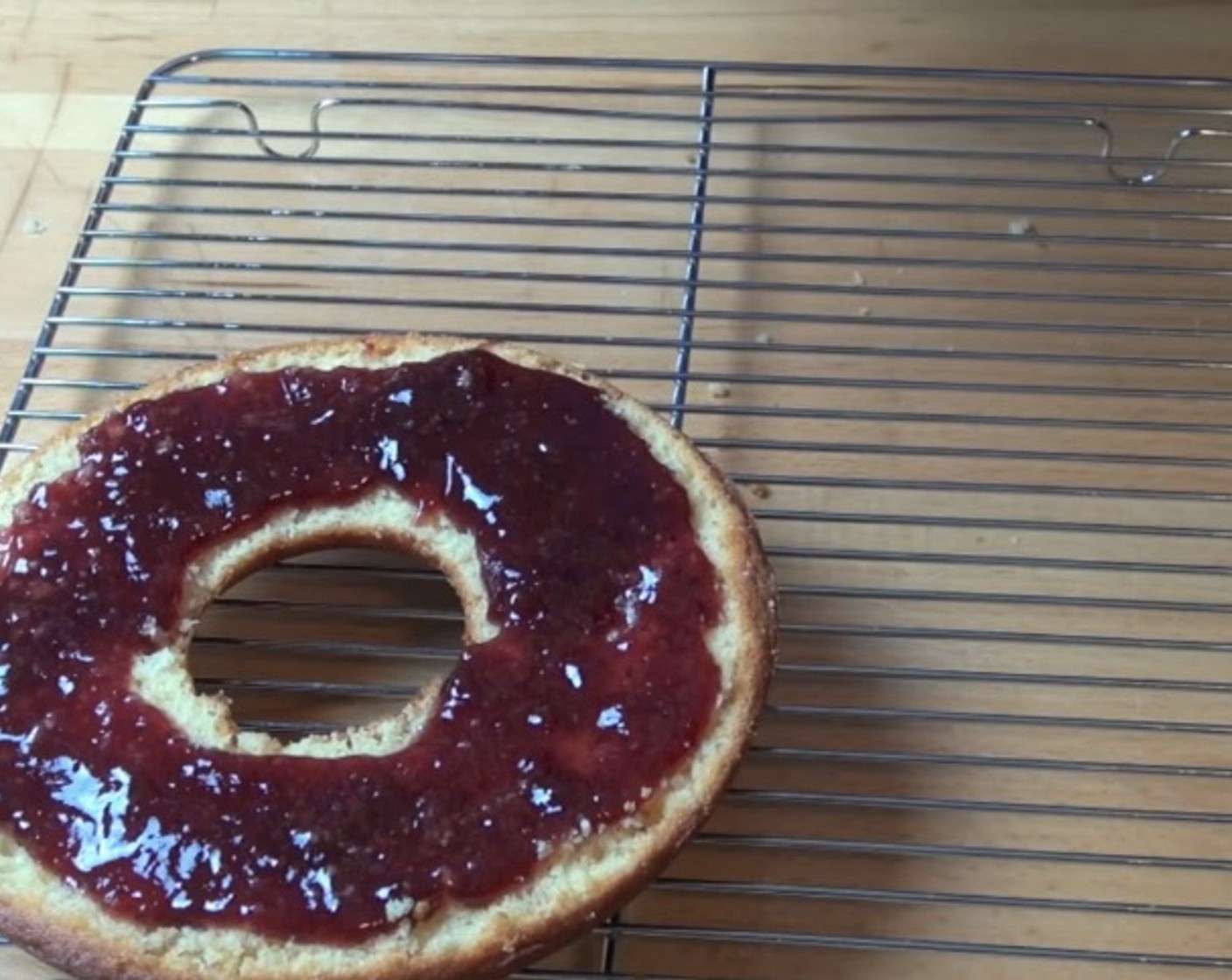 step 8 Spread Fruit Jam (1/2 cup) over one half of the cake as the filling. Gently place the other half on top.