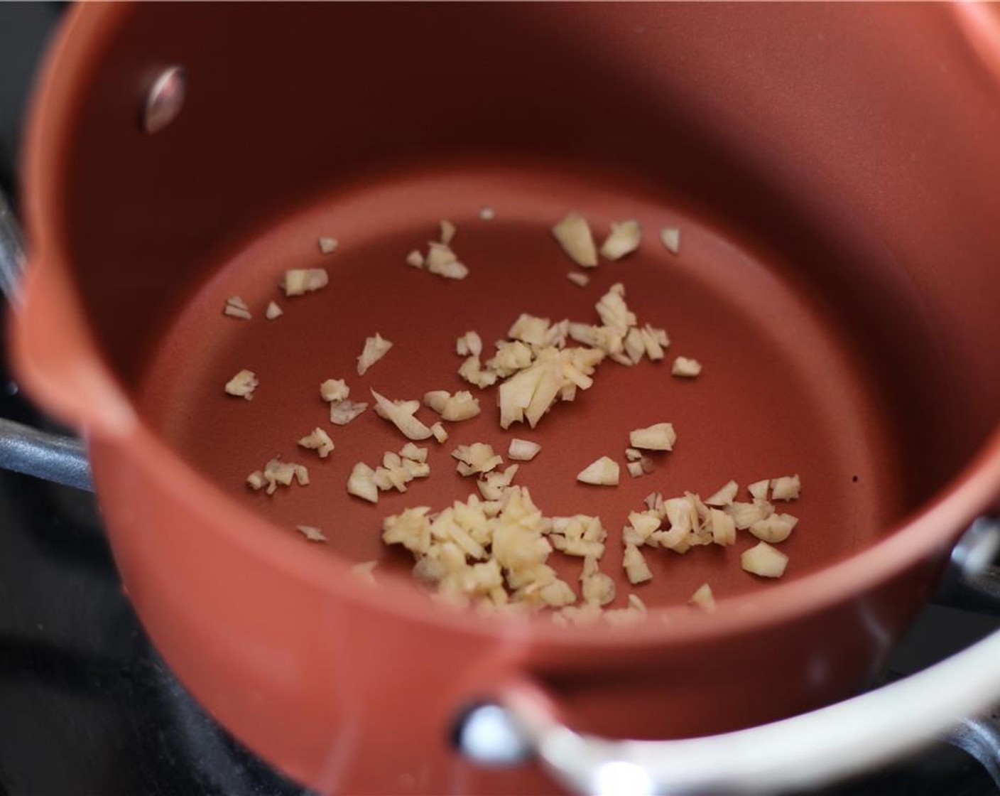 step 2 Cut the Garlic (1 clove) in half. Rub 1/2 of garlic over inside of fondue pot. Mince the other 1/2 clove up finely and add to pot.