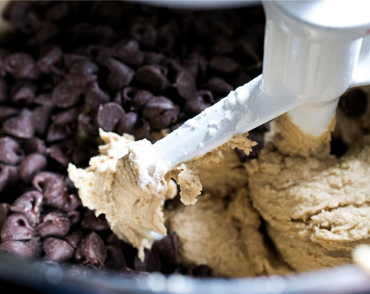 step 4 Slowly add the dry ingredients to the wet ingredients and mix well. Add the Semi-Sweet Chocolate Chips (1 pckg) and continue to mix until incorporated.