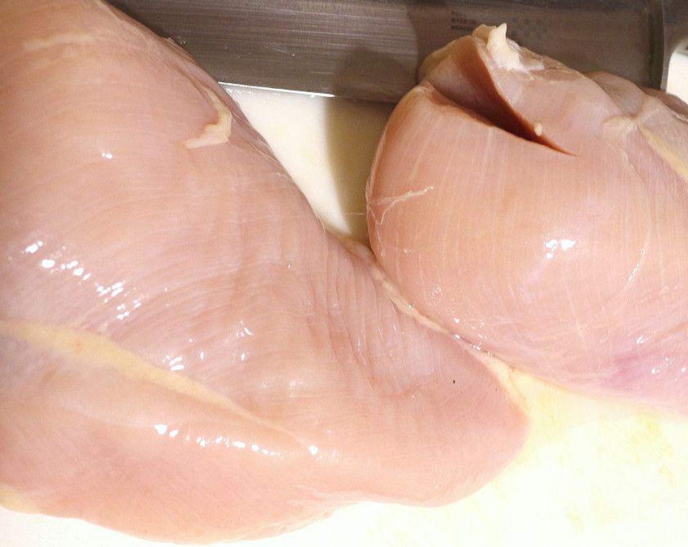 step 2 Flatten Boneless, Skinless Chicken Breasts (2) until evenly thick, then score a criss-cross pattern.