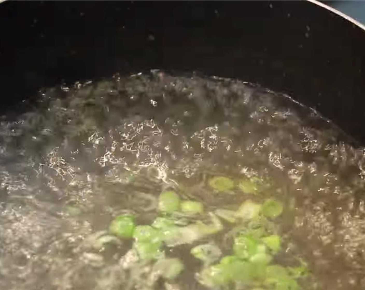 step 9 In a pot, add Water (4 cups), Vegetable Oil (1 tsp), Chicken Bouillon Powder (1/2 Tbsp), Salt (1/2 tsp), Granulated Sugar (3/4 tsp), Ground White Pepper (1/8 tsp), 1 tsp sake, Sesame Oil (1/2 tsp), and the chopped green onion.