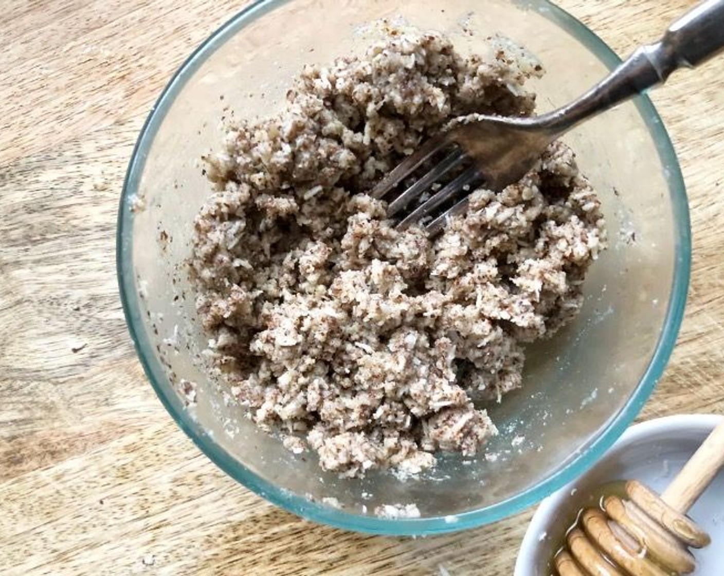 step 6 In a bowl, combine the Almond Flour (1/2 cup), Almonds (2 Tbsp), and Unsweetened Shredded Coconut (4 Tbsp). Add in the Coconut Oil (2 Tbsp) and Honey (2 Tbsp) and mix with a fork until large crumbs form.