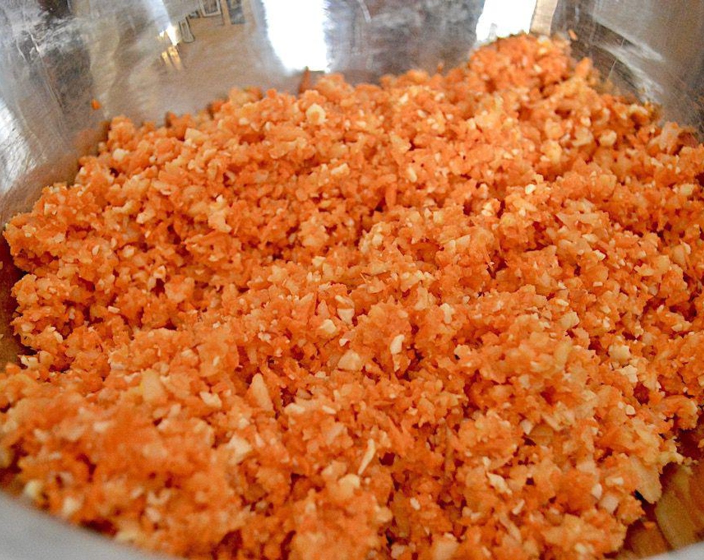 step 4 While the quinoa is cooking and cooling, combine Carrots (2 cups), Apples (2), Garlic (2 cloves), Onion (1/2), Fresh Sage (1 Tbsp), and Smoked Gouda (1 cup) in the bowl of a food processor and pulse it all together.
