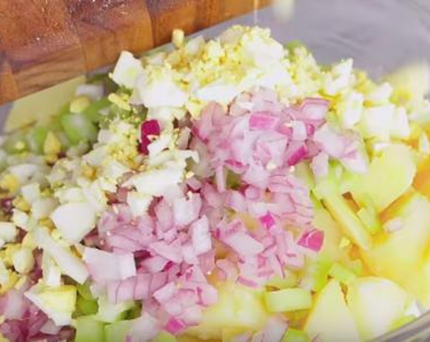 step 3 Chop down the hard-boiled eggs, and add it to the potato together with the Red Onion (1/2 cup), and the Celery (1 cup). Mix everything well.