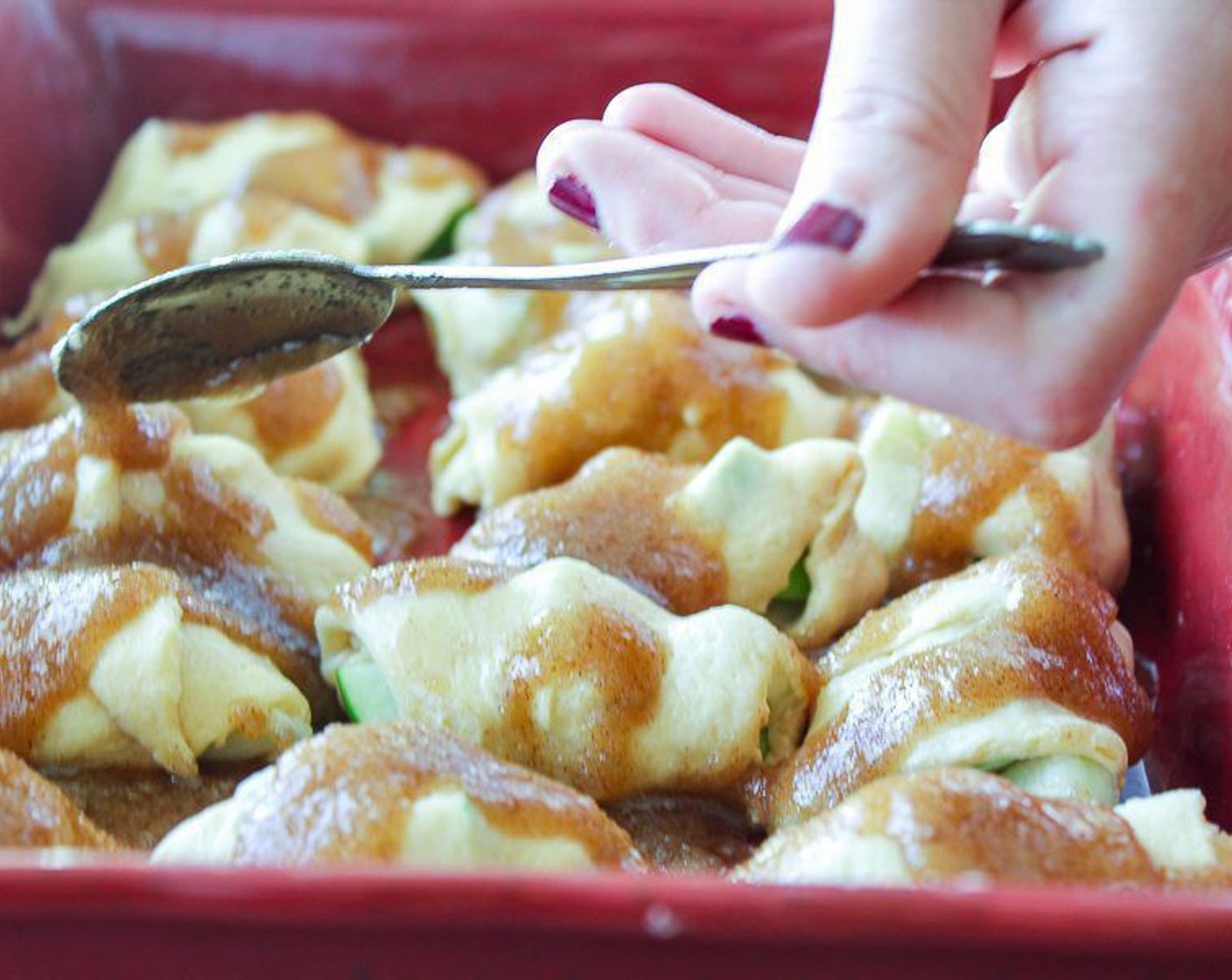 step 6 In a small bowl, combine Salted Butter (1/2 cup), Simply Organic Cinnamon, Ground (1 tsp), Vanilla Extract (1 tsp), Granulated Sugar (3/4 cup), and Brown Sugar (3/4 cup). Spoon the sugar mixture over the top of the dumplings evenly.