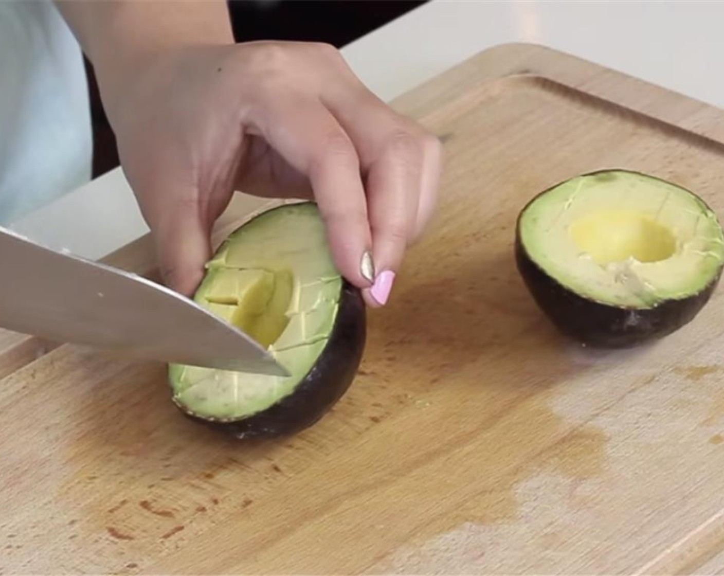 step 6 Core and dice one Avocado (1) and transfer to the bowl of shredded chicken.