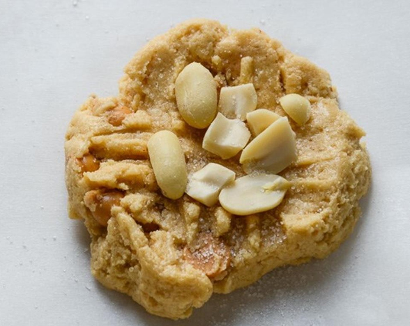 step 5 Scoop the dough into rounded tablespoons and deposit 3 inches apart on the baking sheet. Create a hashtag with a fork and sprinkle the tops of the cookies with a little Granulated Sugar (to taste) and Peanuts (1/2 cup). Bake for 5 minutes.