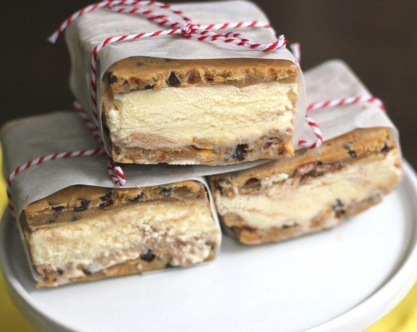 step 5 Cut into ice cream sandwiches into squares. You can press the sides of the sandwiches into sprinkles or chopped Reese's pieces if you'd like. Wrap in parchment paper and place in an air tight container and freeze the leftovers!