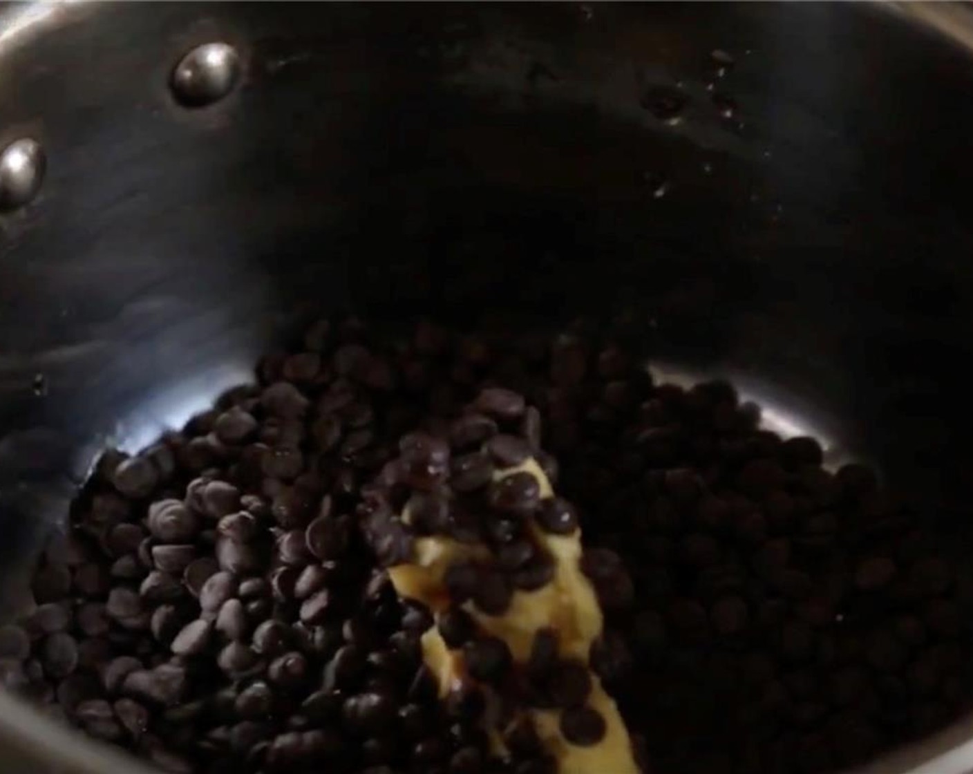 step 9 To make ganache, combine Semi-Sweet Chocolate Chips (3/4 cup), Guinness® Stout Beer (2 Tbsp) and Butter (3 Tbsp) in a saucepan until Guinness gets hot and butter starts to melt.