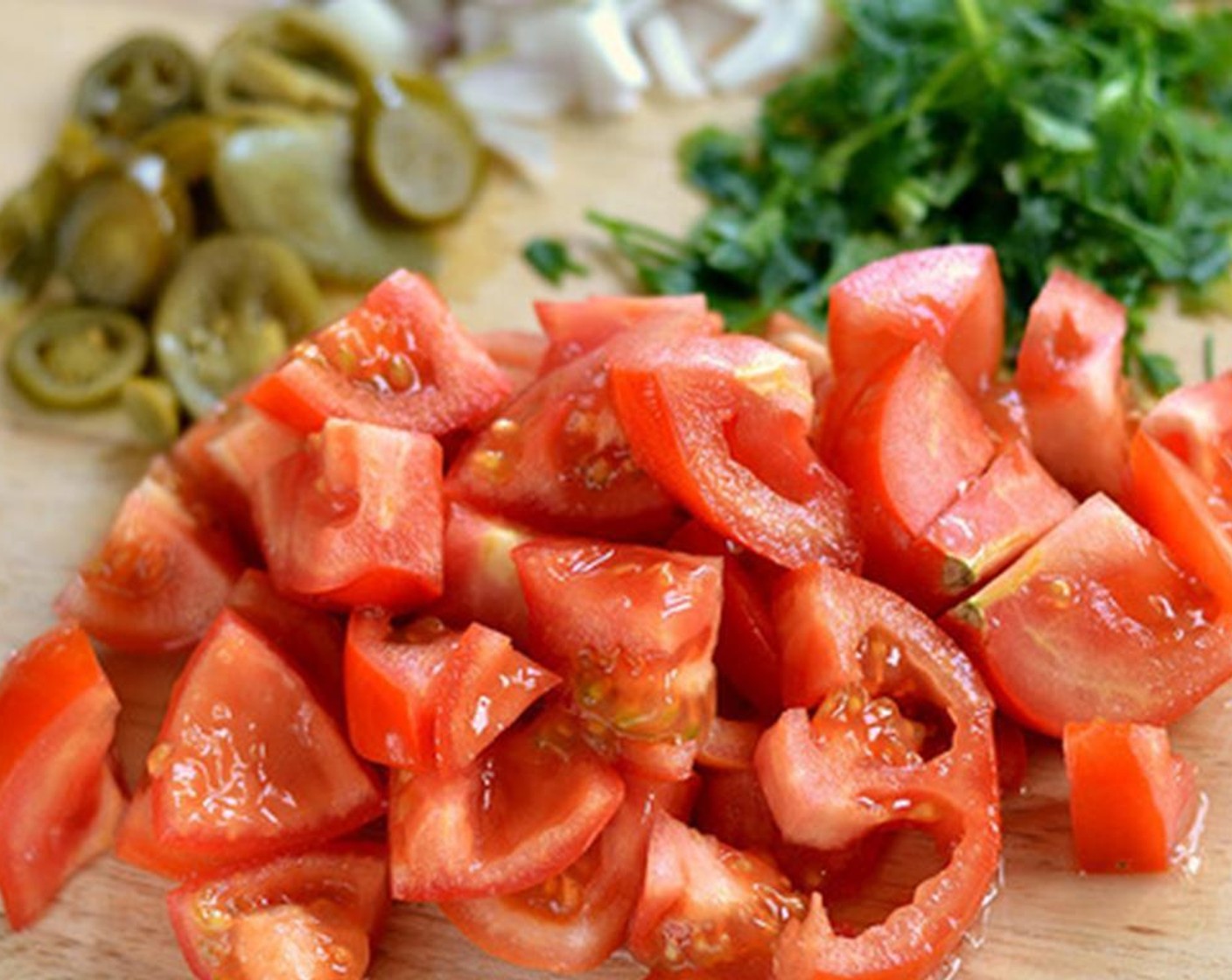 step 1 Dice the Tomato (1) and Onion (1). Slice the Fresh Cilantro (to taste).