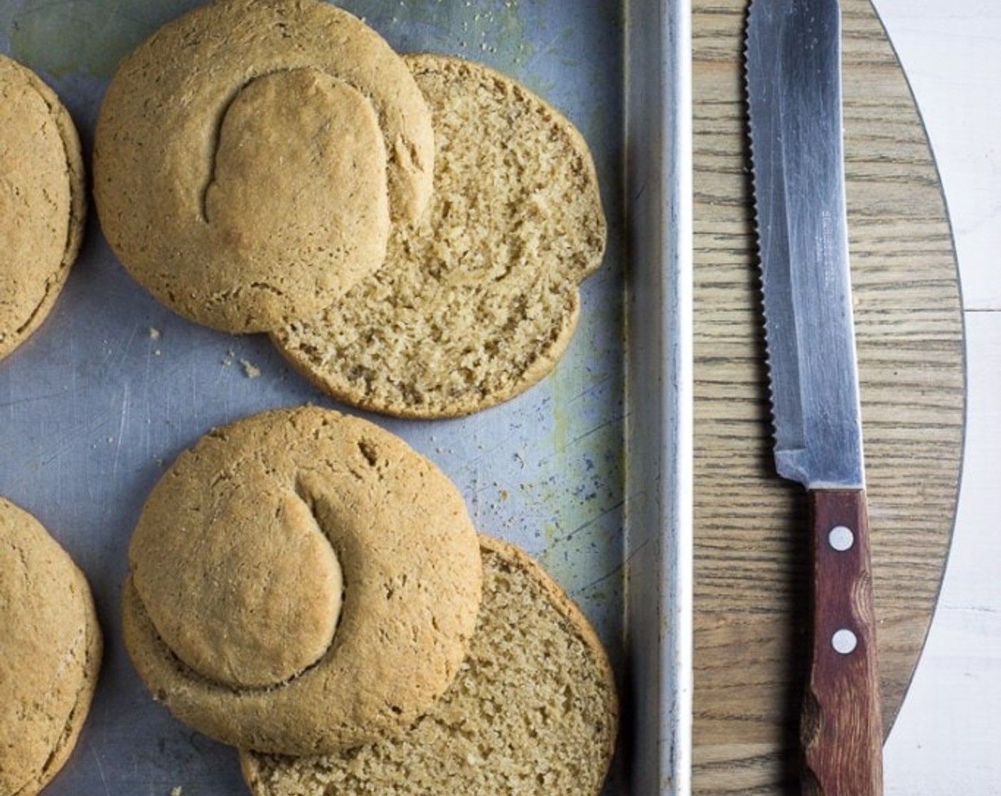 step 10 Place baking sheets in the center of the oven and bake paximadia for 40 minutes, rotating the sheets halfway into the baking time (after 20 minutes). When done, remove from oven and let cool until you can handle them. Slice each paximadi in half with a serrated knife.