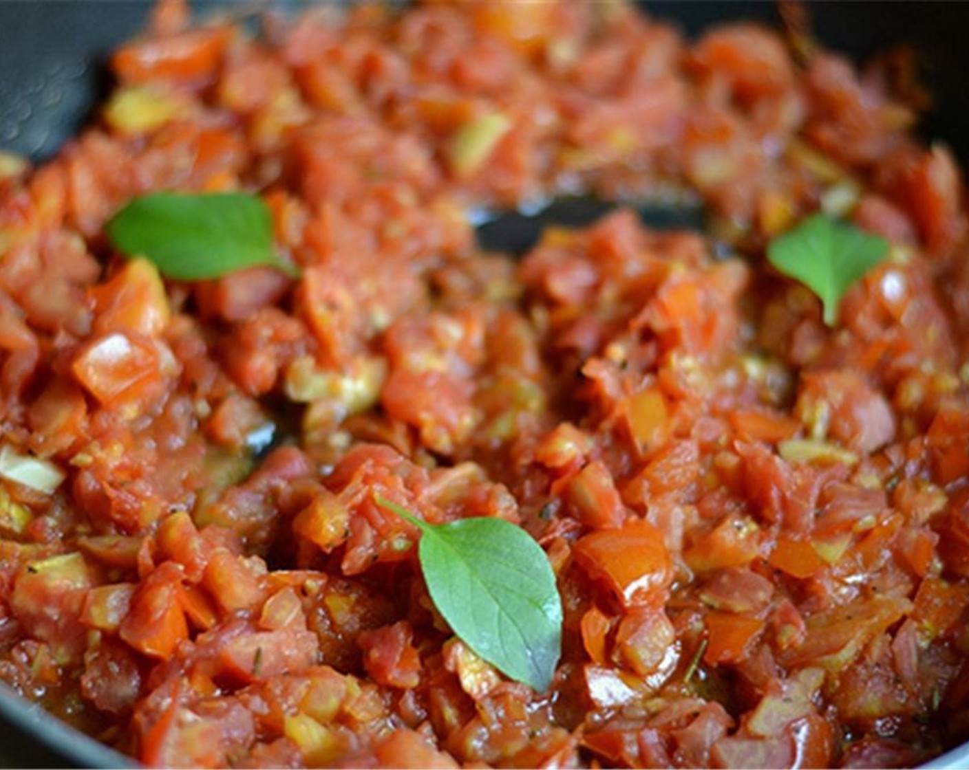 step 5 Once reduced and you have around 5 minutes to go, throw in a couple of Fresh Basil (to taste).