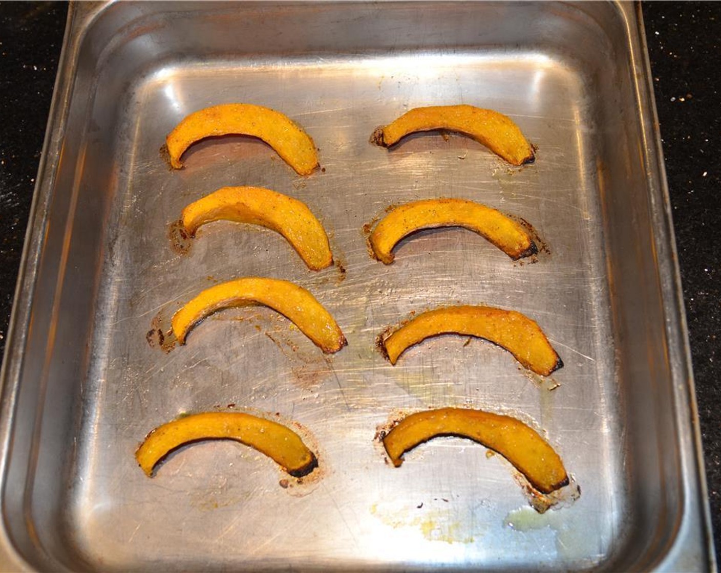 step 5 Place wedges on a baking sheet and set in the middle part of the oven to bake for about 20 to 25 minutes until the squash is cooked through but al dente. Set aside and keep warm.