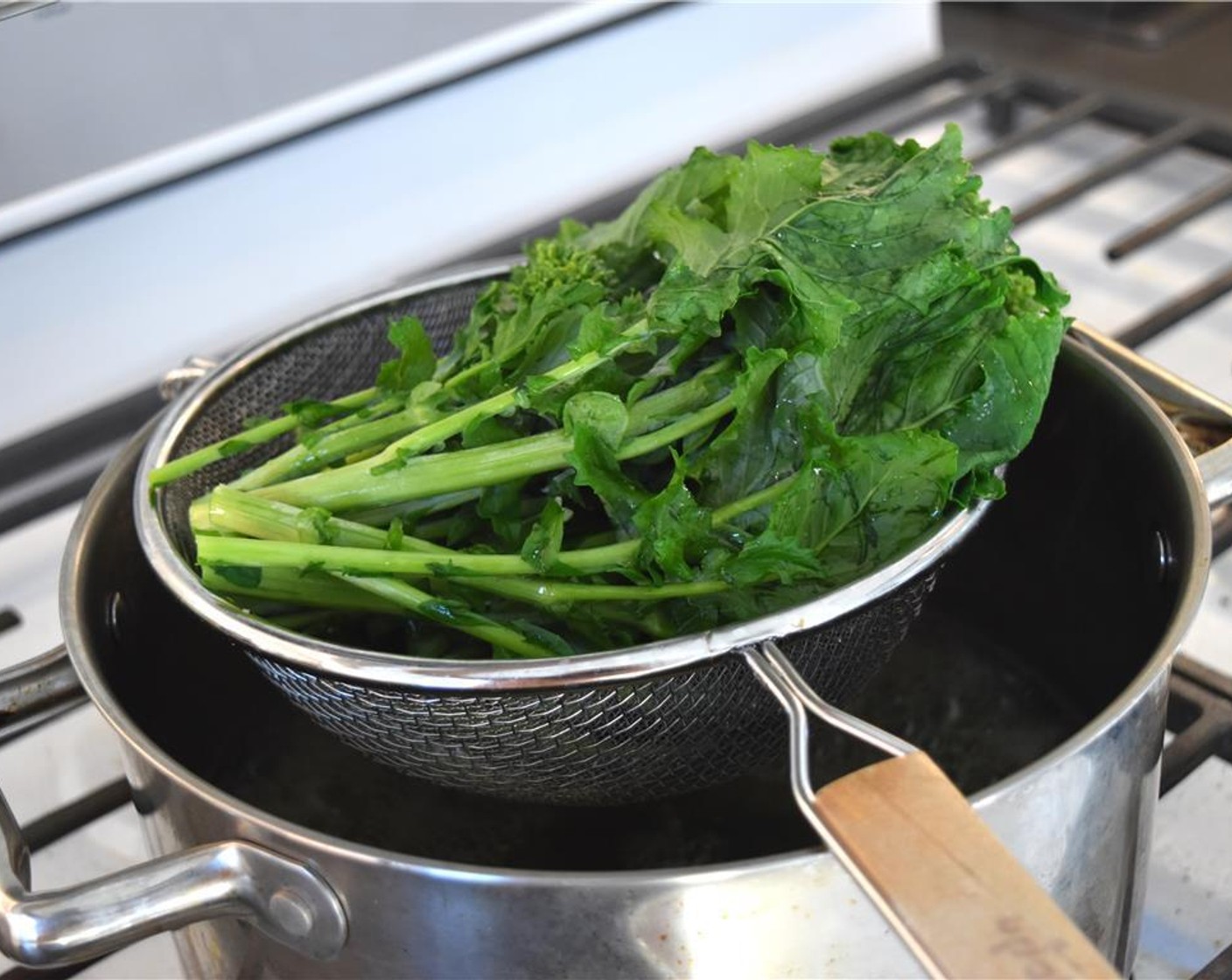 step 5 After 5 minutes, add the Broccoli Rabe (1 bunch) to the steamer, and steam for another 10 minutes.