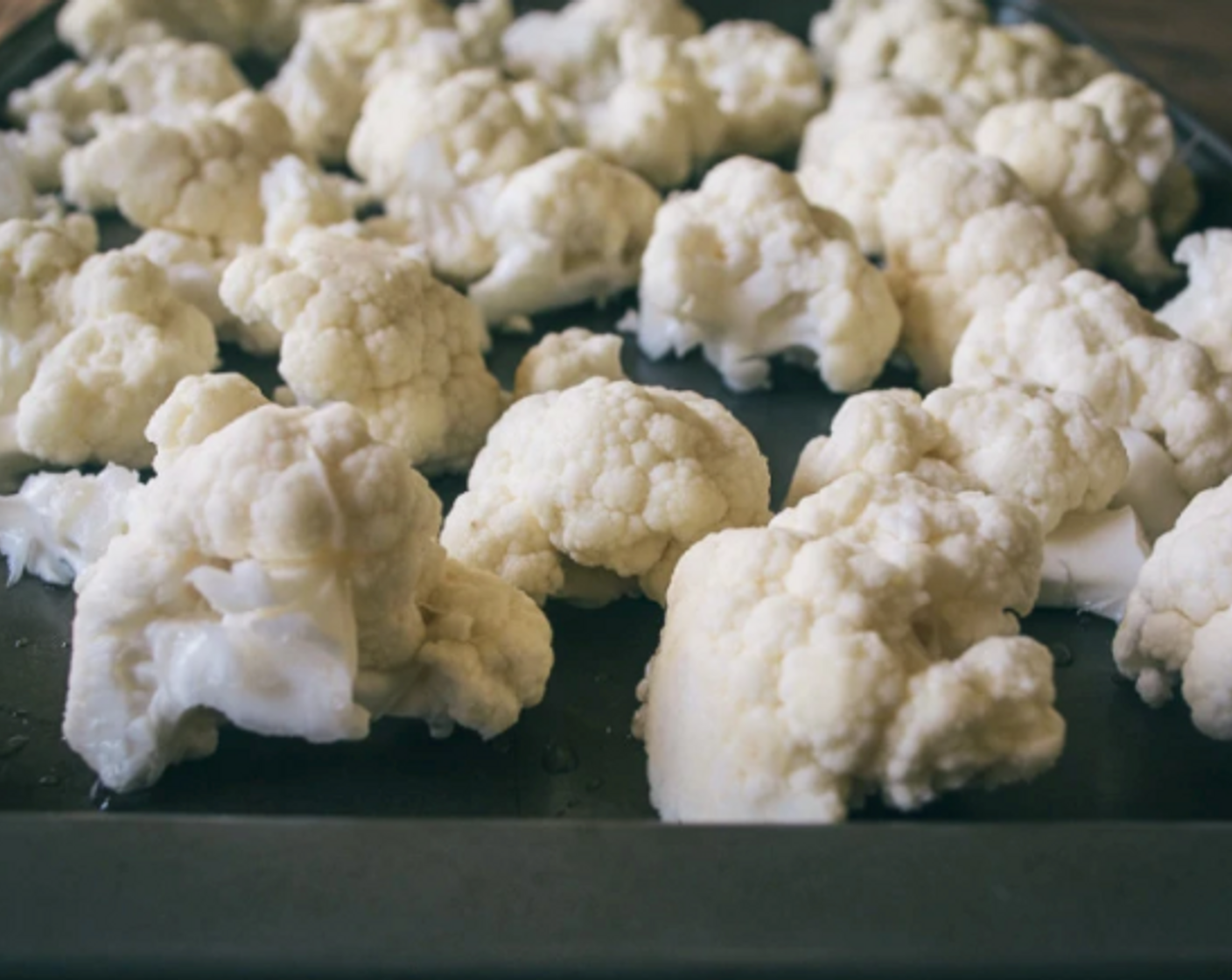step 3 Wash and cut Cauliflower (1 head) into florets and spread out in single layer on prepped cooking sheet.