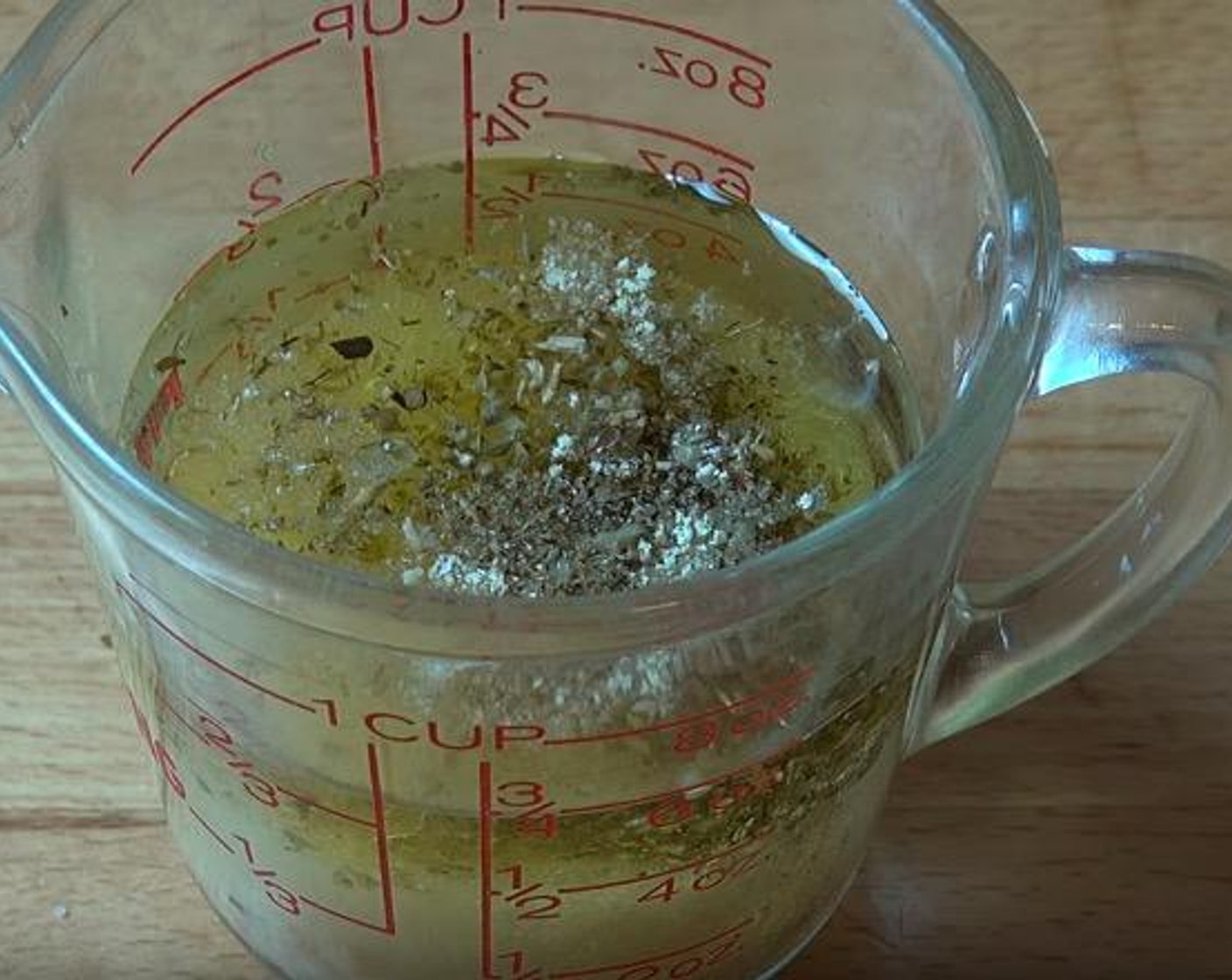 step 1 In a small jug, add Olive Oil (1/4 cup), the juice from Lemons (2), Dried Oregano (1 tsp), Onion Powder (1 tsp), Garlic (2 cloves), Salt (1 tsp), and Freshly Ground Black Pepper (to taste). Stir together.
