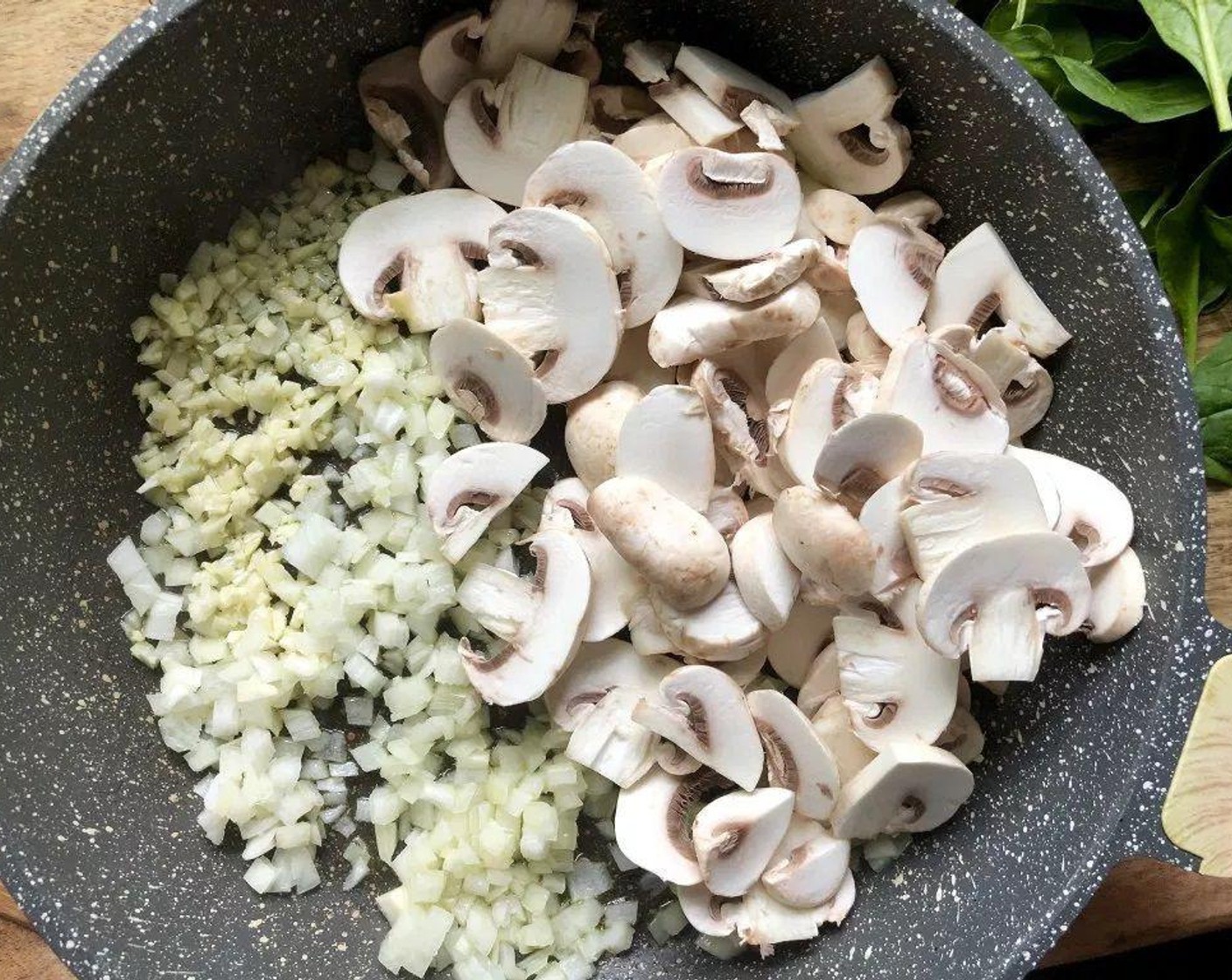step 4 Heat Olive Oil (1 Tbsp) in a large nonstick skillet over medium-high heat. Add Onion (1/2 cup), Button Mushrooms (2 1/4 cups), and Garlic (3 cloves); sauté three to four minutes until onion and mushrooms are tender. Add Fresh Baby Spinach (5 2/3 cups), cooking until it is wilted.