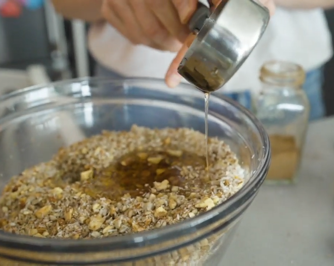 step 7 Add the melted coconut oil and Maple Syrup (4 Tbsp) and stir together.