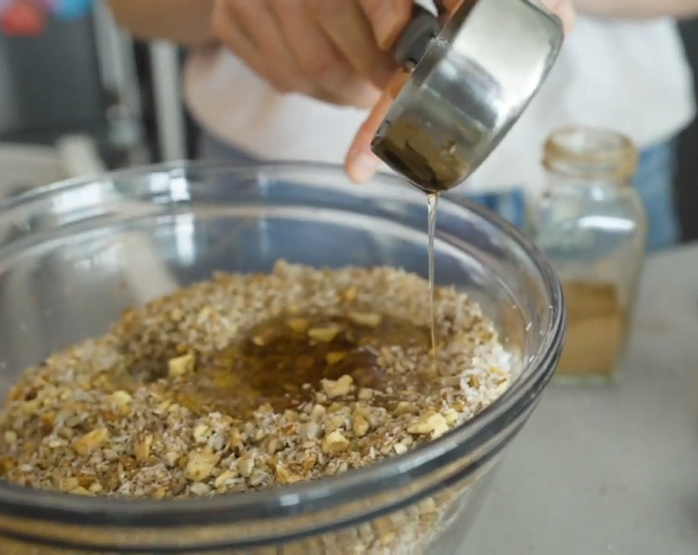 step 7 Add the melted coconut oil and Maple Syrup (1/4 cup) and stir together.