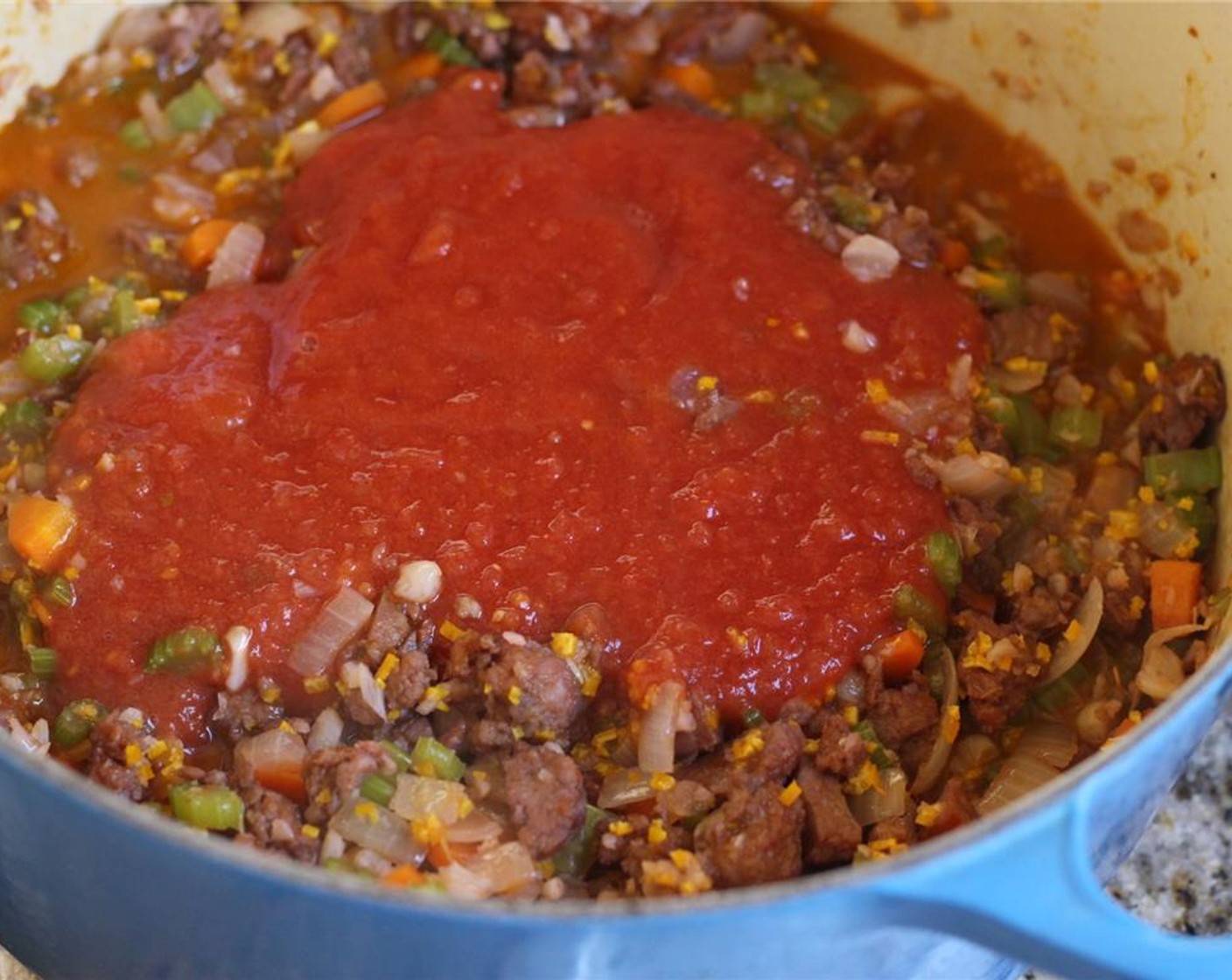 step 6 Add the pulsed tomato and cook until the oil on top turns bright red, about 15 minutes.