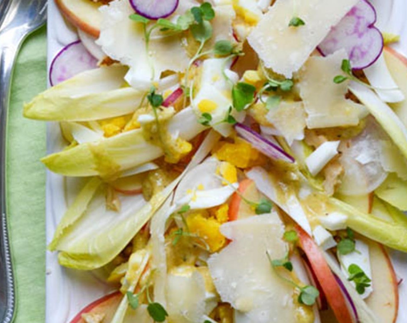 step 9 For shredded Parmesan Cheese (2 Tbsp) sprinkle it evenly over the endive. Sprinkle with Microgreens (to taste) and serve.