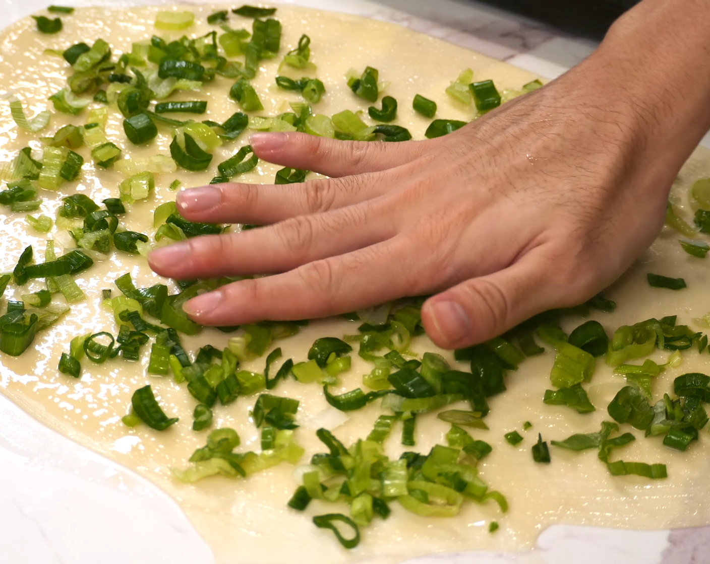 step 8 Brush the surface with some of the roux you made earlier and sprinkle some Scallions (to taste) over.